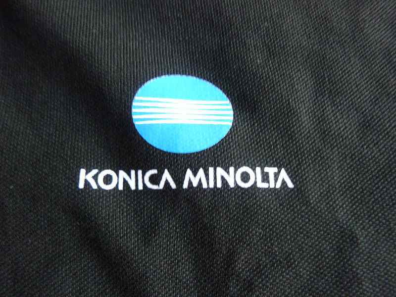 * unused KONICA MINOLTA Konica Minolta gorgeous version short sleeves wear polo-shirt men's commodity tag attaching! postage postal 360 jpy only *