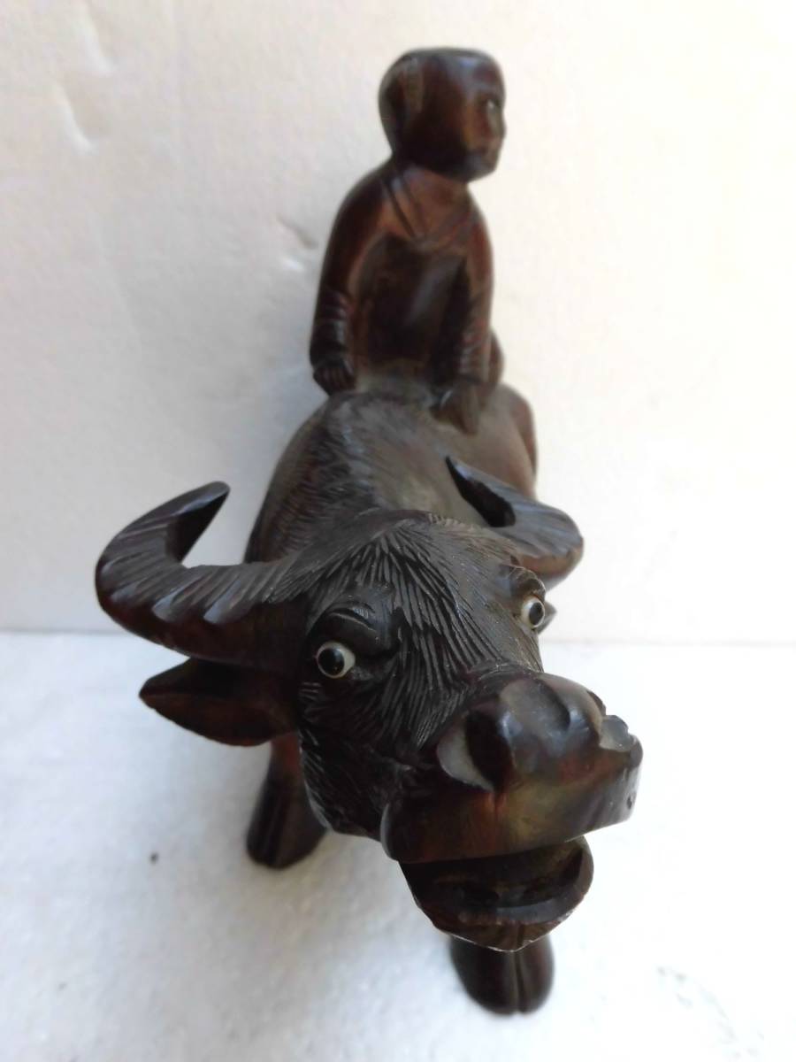  wooden tree carving cow . ride man dragon eyes tree . chinese quince I think 