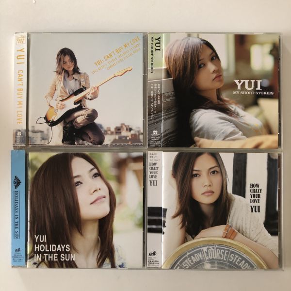 B16696　中古CD　CAN'T BUY MY LOVE (初回限定盤)(DVD付)+MY SHORT STORIES+HOLIDAYS IN THE SUN+HOW CRAZY YOUR LOVE　YUI　4点セット_画像1