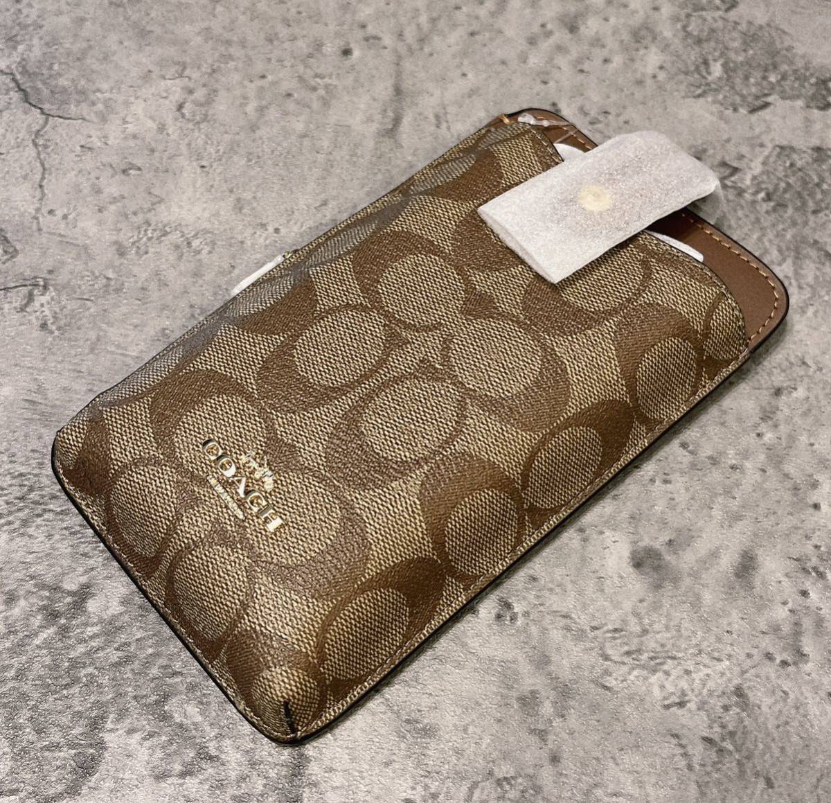 新品 COACH コーチ スマホショルダー クロスボディ カーキ シグネチャー