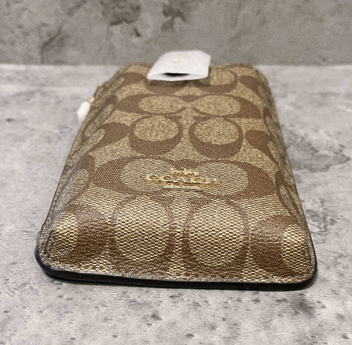 新品 COACH コーチ スマホショルダー クロスボディ カーキ シグネチャー