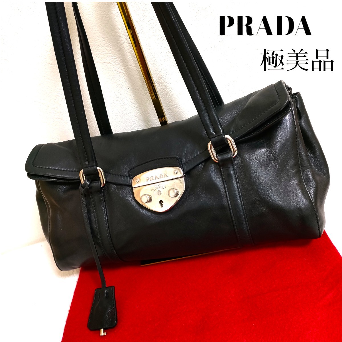 素敵でユニークな プラダ トートバッグ 金具ロゴ オールレザー PRADA