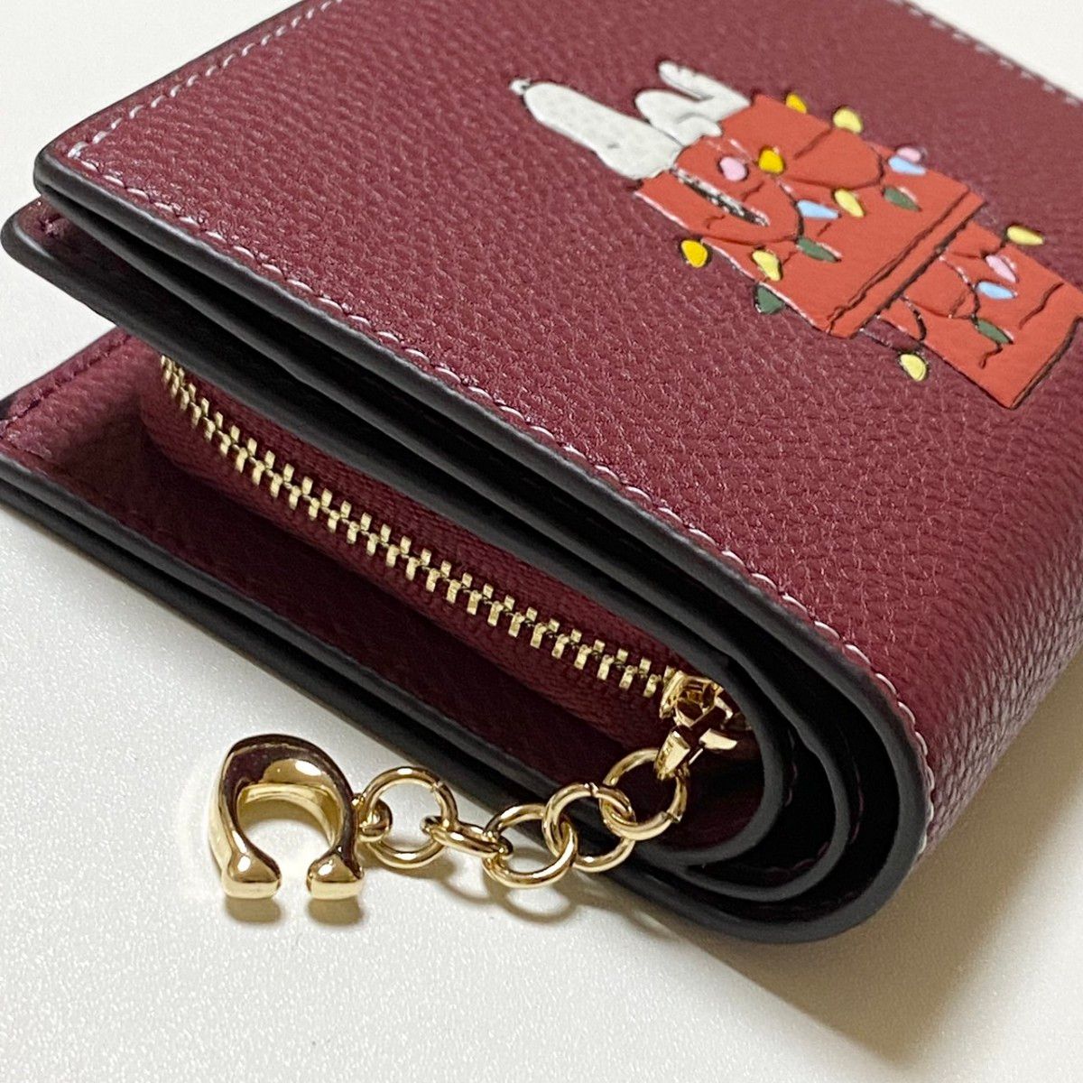 新品/未使用品 COACH 二つ折り財布 スヌーピー ワインマルチ CF252