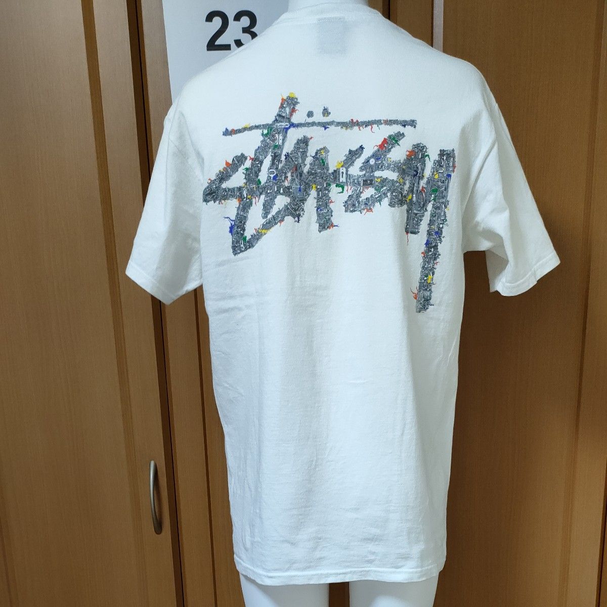 ステューシー半袖TシャツM 機械仕掛けの鉄塔 折れた王冠クラウンマーク バックには鍵穴と歯車多数のSTUSSYロゴプリント