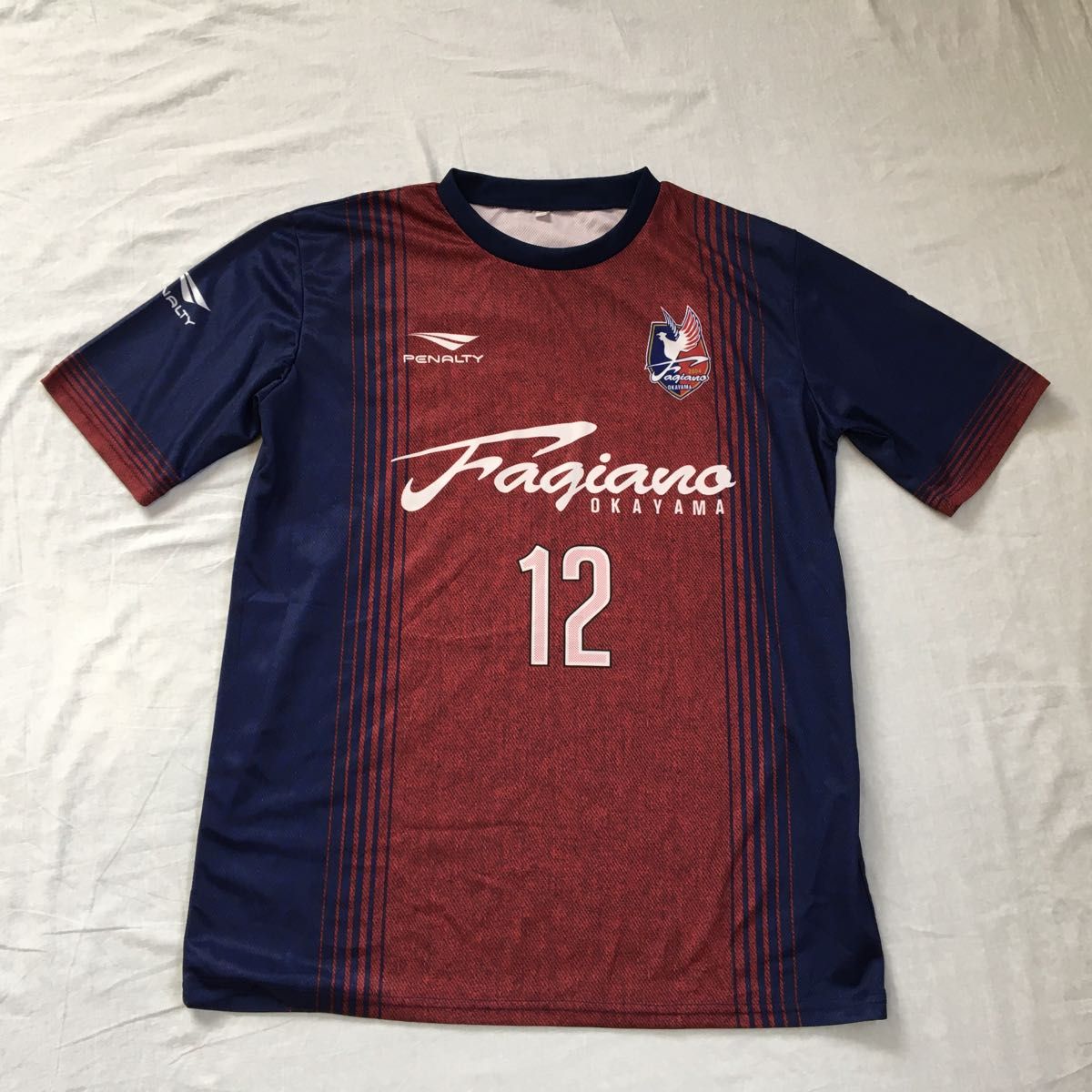 ペナルティ　サッカー　Ｏサイズ　赤×紺　ファジアーノ岡山 限定ユニフォームシャツ ユニフォームTシャツ　VS京都サンガFC