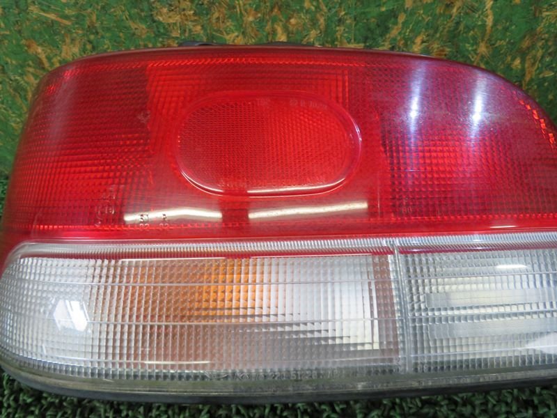 [psi] Daihatsu G213S G200S G201S G203S Charade latter term left tail lamp Koito 220-51328 H10 year 