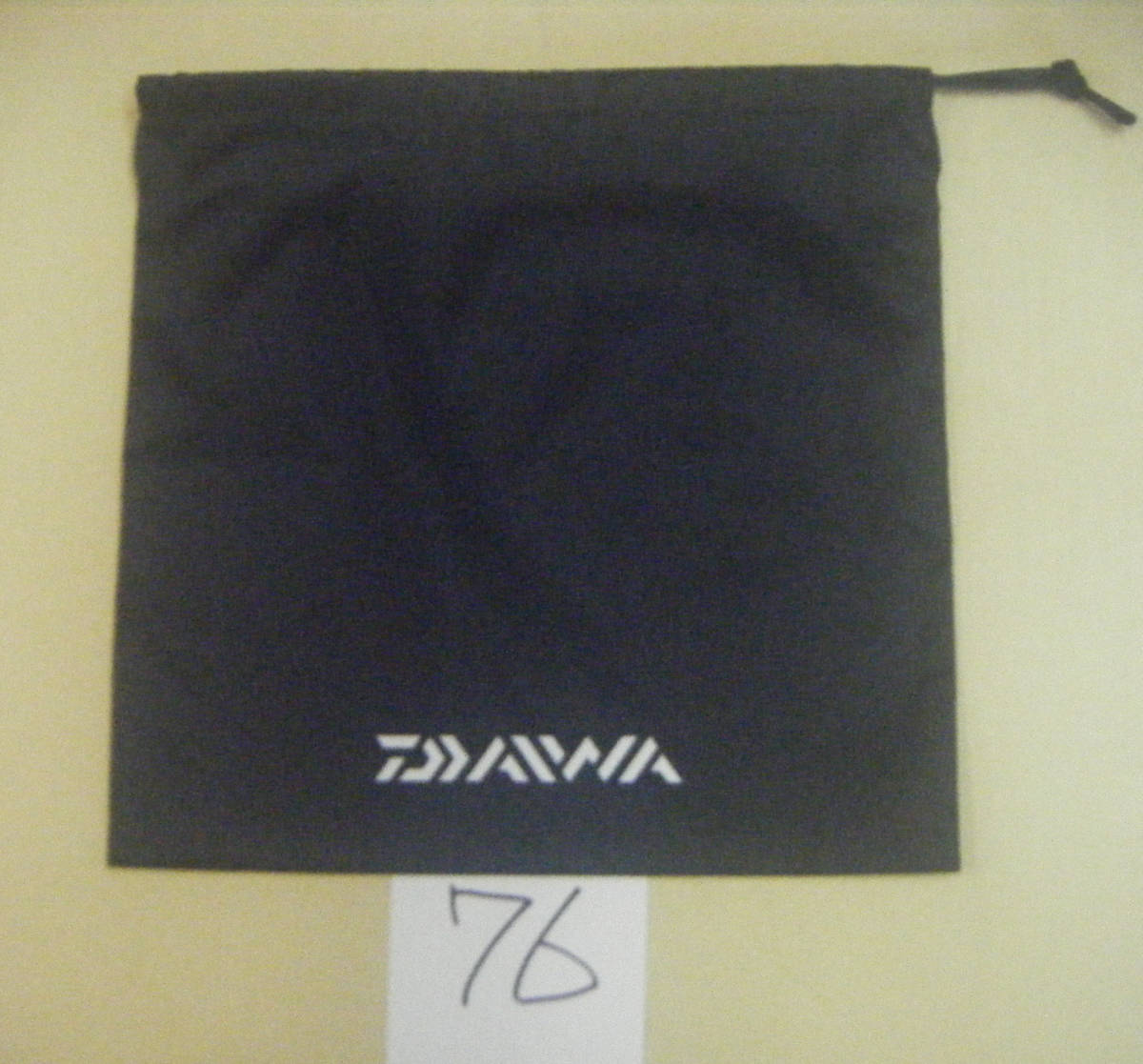 DAIWA ダイワ 純正 黒リール袋 （76） 25X25ｃｍ 少し大きめナイロン素材 _画像1