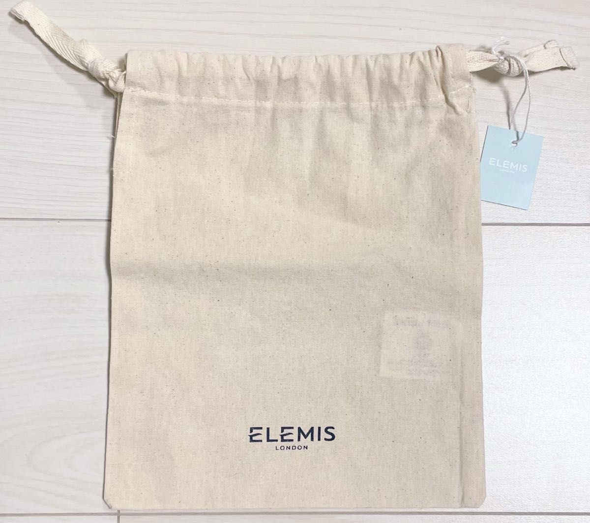 エレミス ELEMIS オーガニックコットン 巾着 ポーチ cottonbag 綿 ベージュ ロゴ タグ付き新品 有機 収納