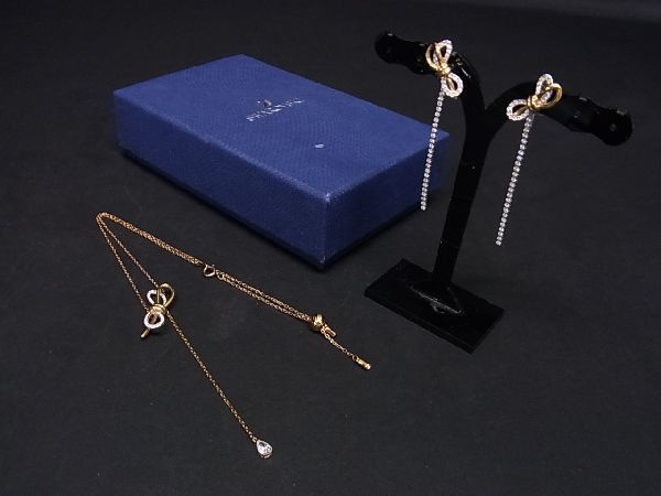 ■新品■未使用■ SWAROVSKI スワロフスキー ラインストーン リボン ネックレス ピアス アクセサリー 2点セット ゴールド系 AR5752