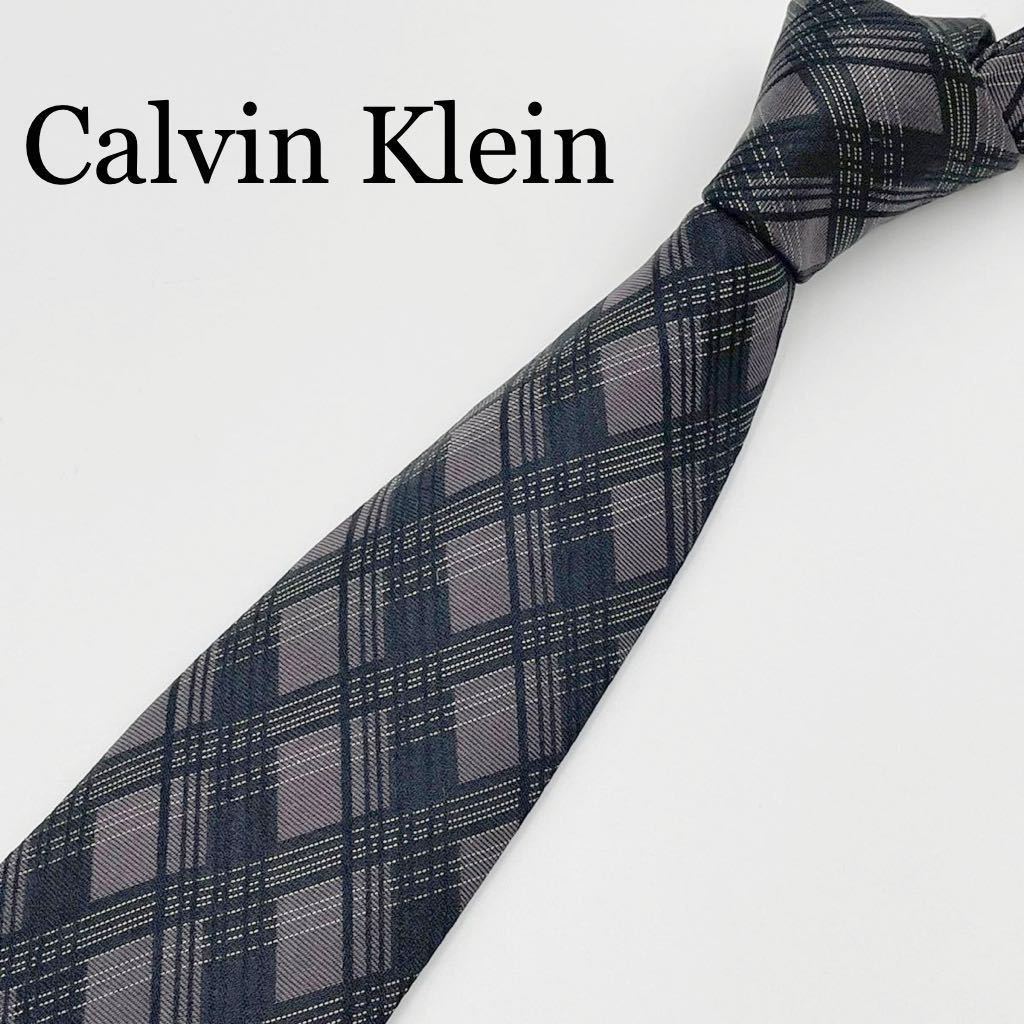 未使用級 イタリア製 カルバンクライン レギュラータイ　ネクタイ チェック 黒 × ダークグレー Calvin Klein シルク 光沢感 ビジネス 通勤