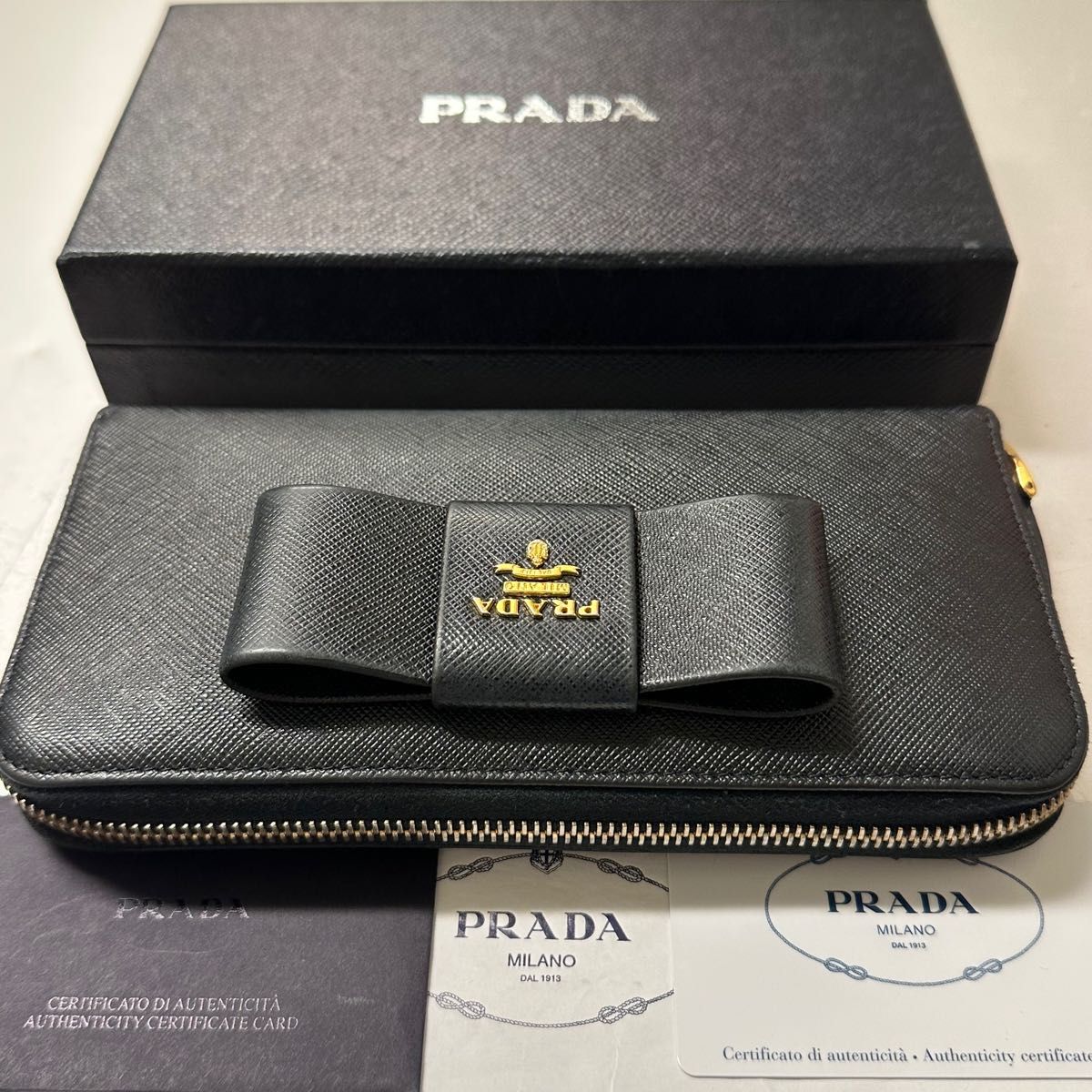 ほぼ新品 プラダ PRADA 財布 長財布 サフィアーノ リボン ラウンド