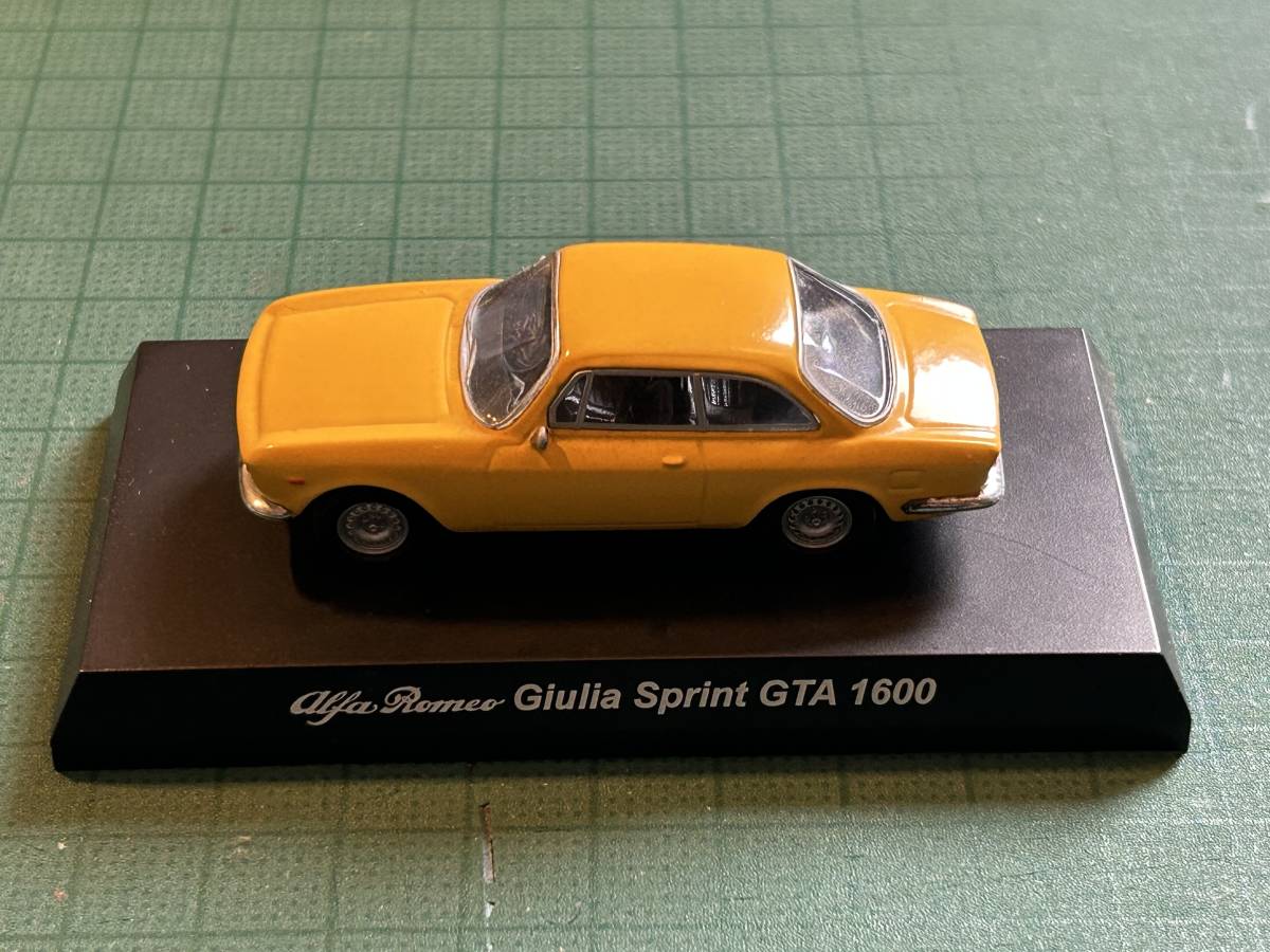 1/64 京商 アルファロメオ ミニカーコレクション Giulia Sprint GTA 1600 ジュリアスプリント黄色、開封済み、箱なし、カード有。_画像1