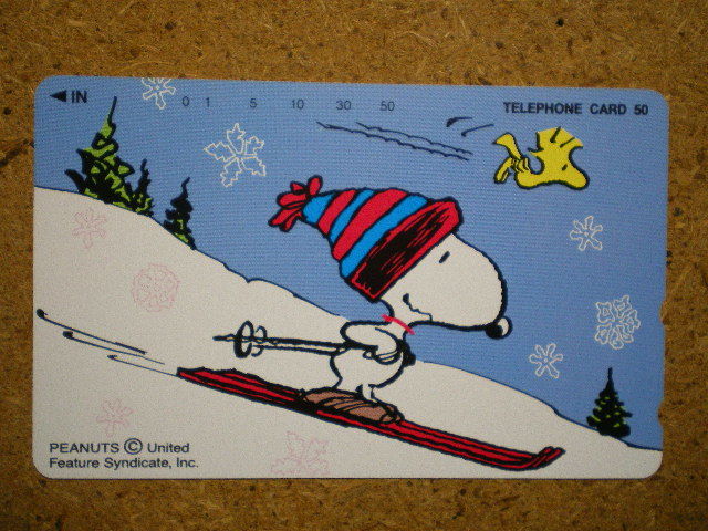 mang*330-60438 лыжи Snoopy телефонная карточка 