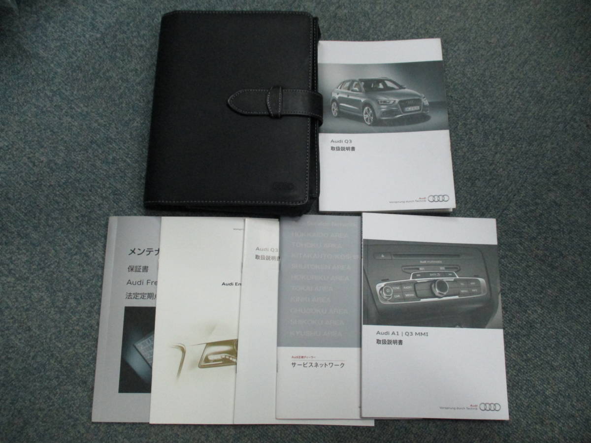 ☆YY16315 AUDI アウディ Q3 8UCPSF 取扱説明書 取説 2013年7月発行 メンテナンスノート未記入ページ多数 レザーケース付き 一律送料520円_画像1