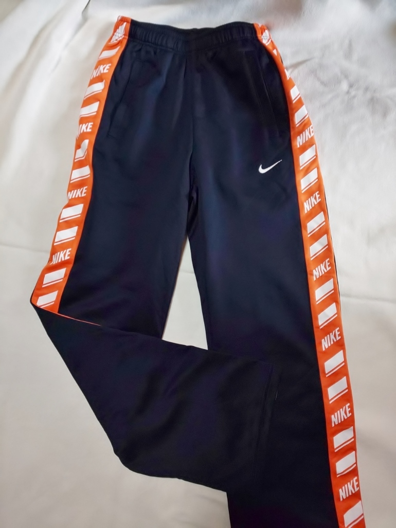 black and orange nike pants