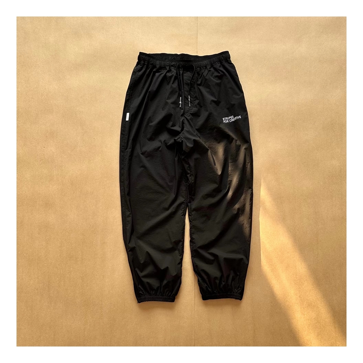 STRIPES FOR CREATIVE◇S.F.C ウインドブレーカーパンツ/黒L-日本