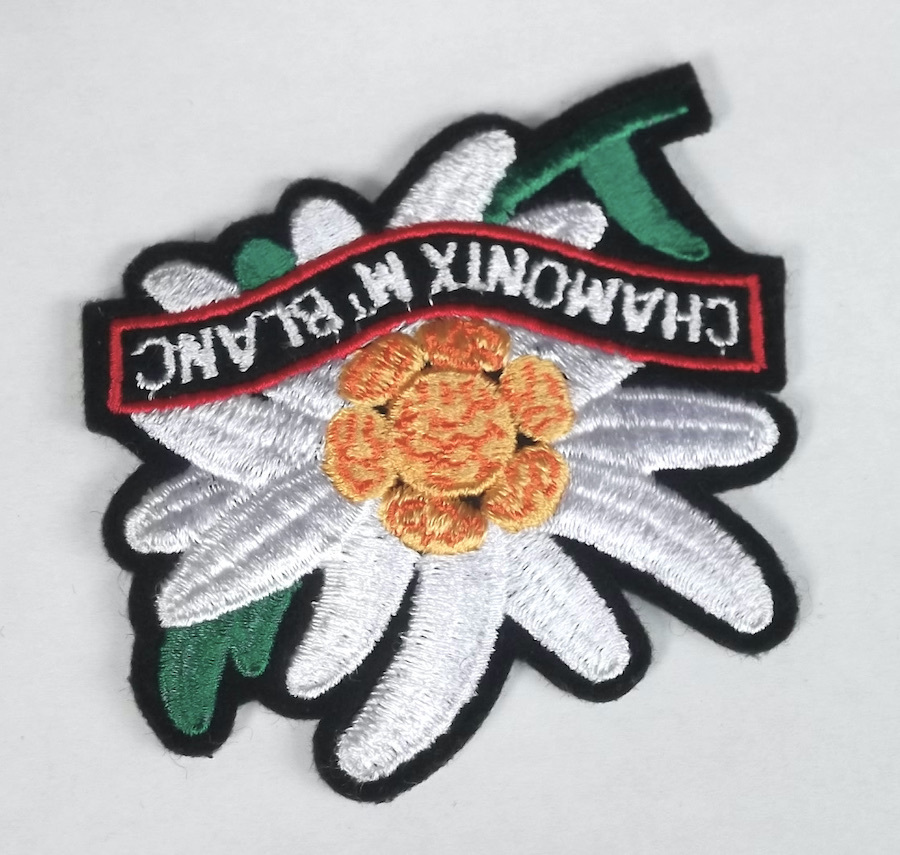  old embroidery badge flower chamonix Montblanc CHAMONIX MT BLANC Alps France Switzerland mountain climbing mountains Alpine plants Europe tourist attraction . earth production 