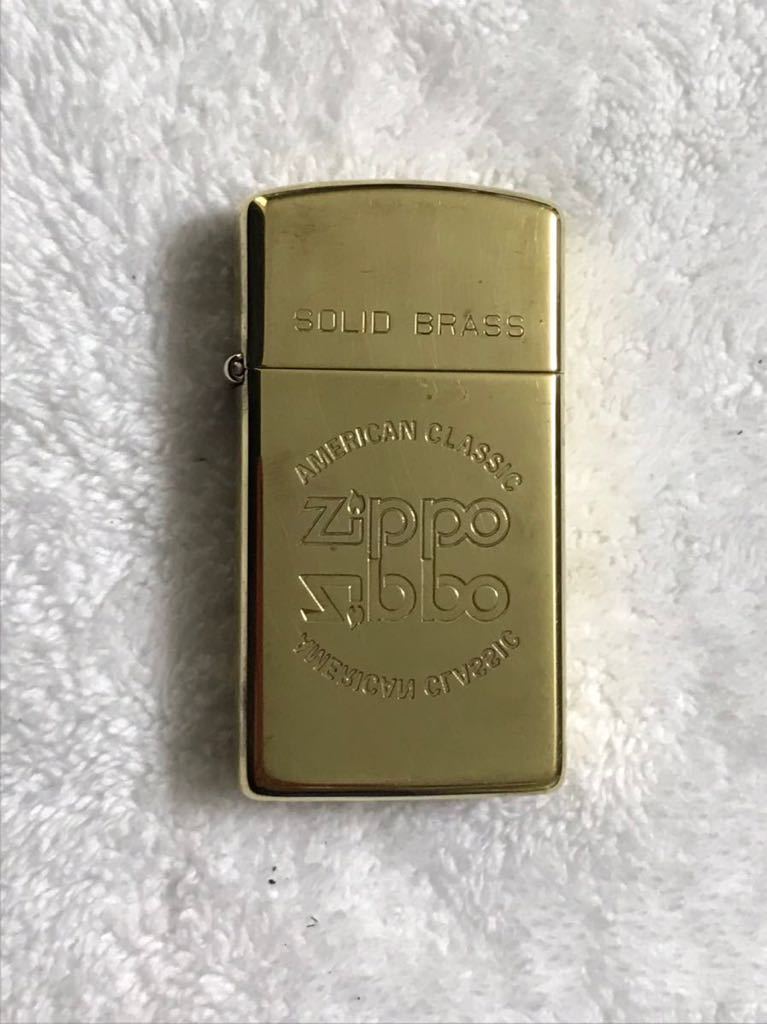 ZIPPO ジッポー SOLID BRASS ソリッドブラス 1992年製　slim スリム　中古品　金色　ゴールド　オイルライター_画像1
