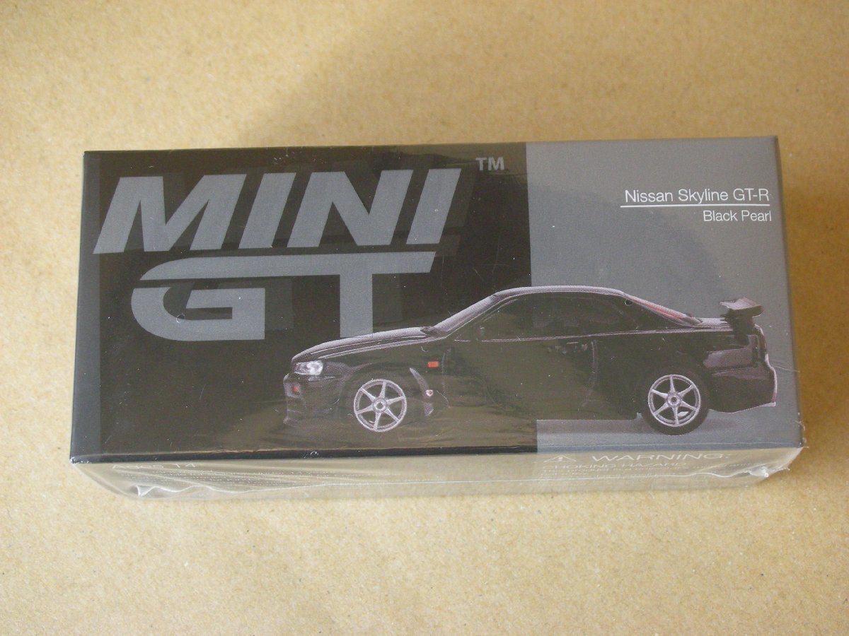 TrueScale Miniatures MINI GT 1/64 ニッサン スカイライン GT-R R34 V-Spec 右ハンドル 完成品_画像1