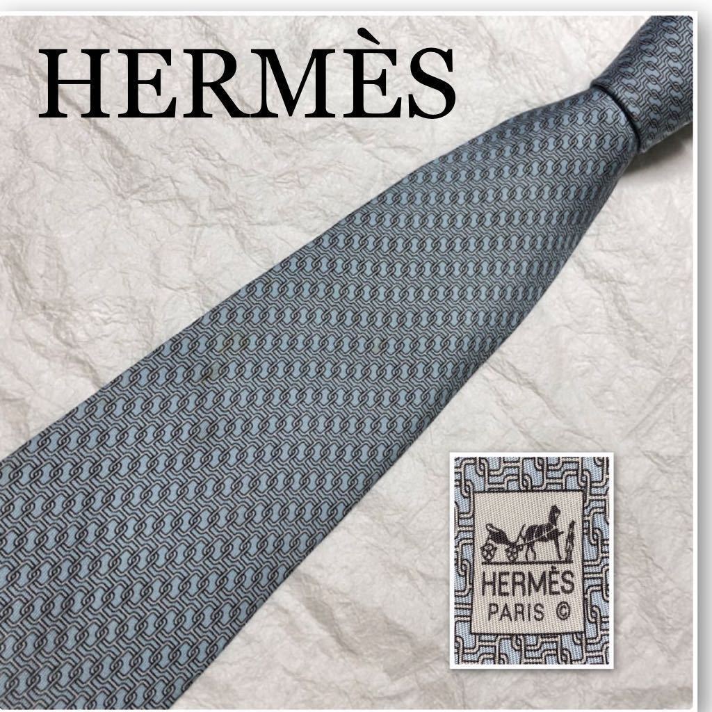 HERMES エルメス　ネクタイ　金具総柄　シルク100% フランス製　ライトブルー