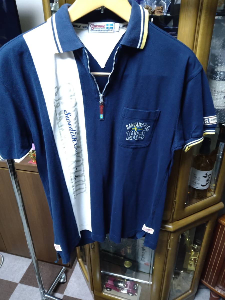 HPS２９半袖ポロシャツ襟首ジッパー刺繍入り SANTA WORLD XL 紺色系  綿 中国製 中古良品１枚の画像1