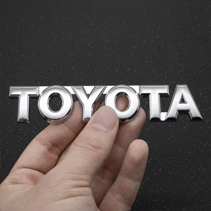 【送料込】TOYOTA 3Dエンブレム(両面テープ付) シルバー 縦2.4cm×横12cm　金属製 トヨタ 豊田_画像1