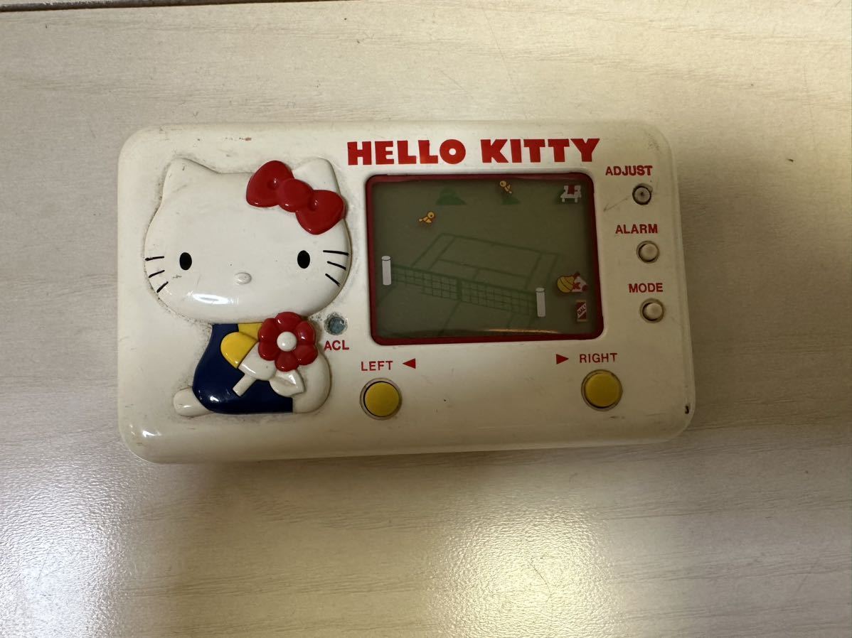 TOMY トミー HELLO KITTY ハローキティ 携帯型ゲーム機 未確認ジャンク品_画像1