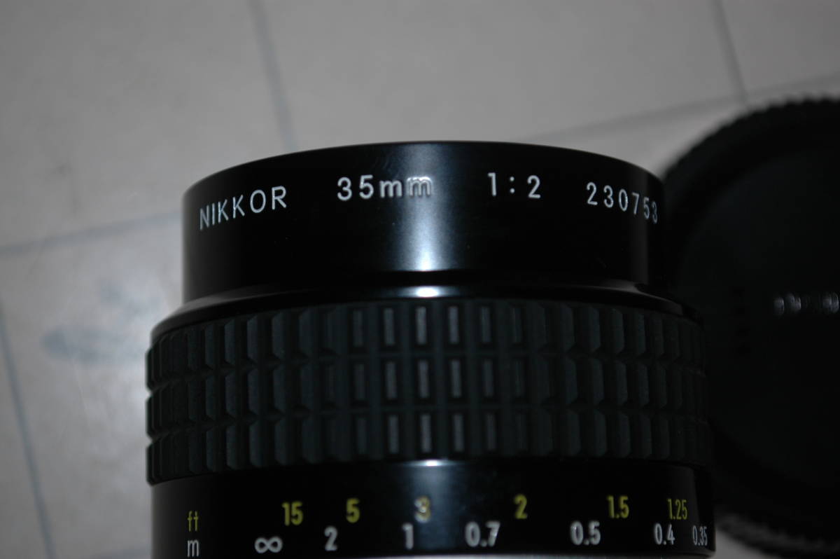 ちょい古の単焦点レンズ Nikon Ai Nikkor 35mm F2 used/美品 送料:520円 検) 前後キャップ フィルター付き 大口径 広角 ニコン 爪有 _画像2