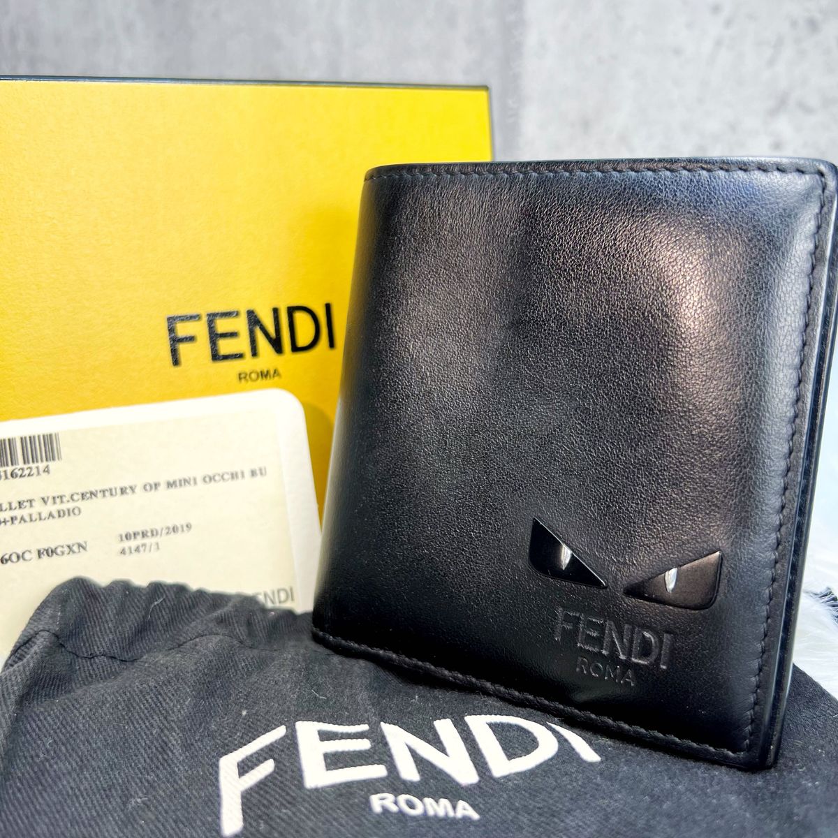 美品 フェンディ FENDI モンスター バグズアイ 二つ折り財布 コンパクトウォレット メンズ レディース ブラック 黒 レザー