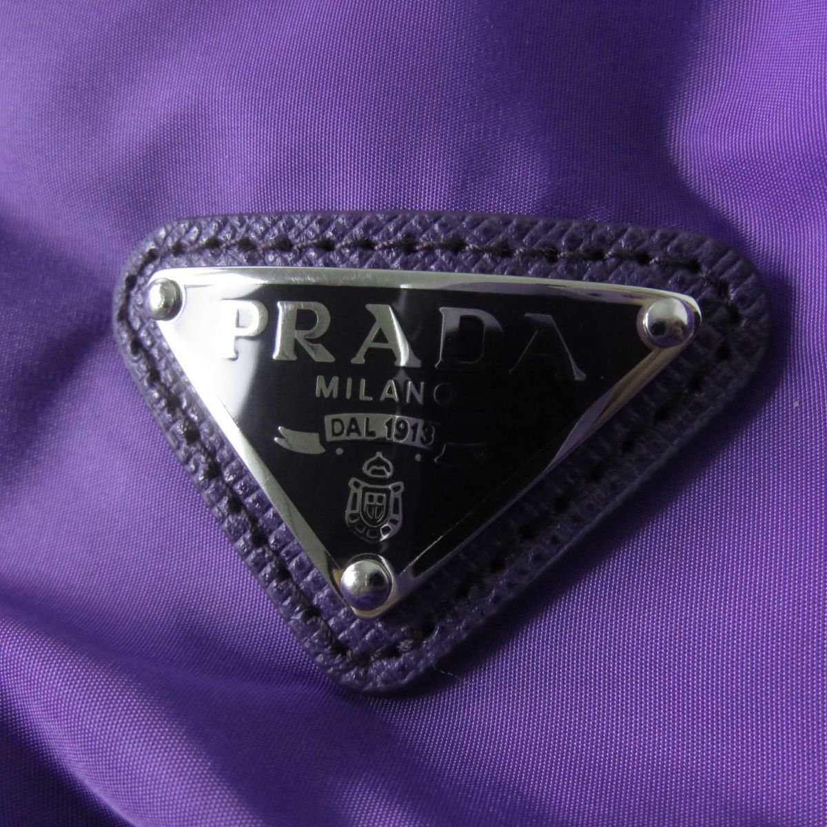 превосходный товар * стандартный товар PRADA Prada 20AW 290543 женский треугольник Logo | треугольник plate с капюшоном . пуховик фиолетовый 46 вешалка имеется 