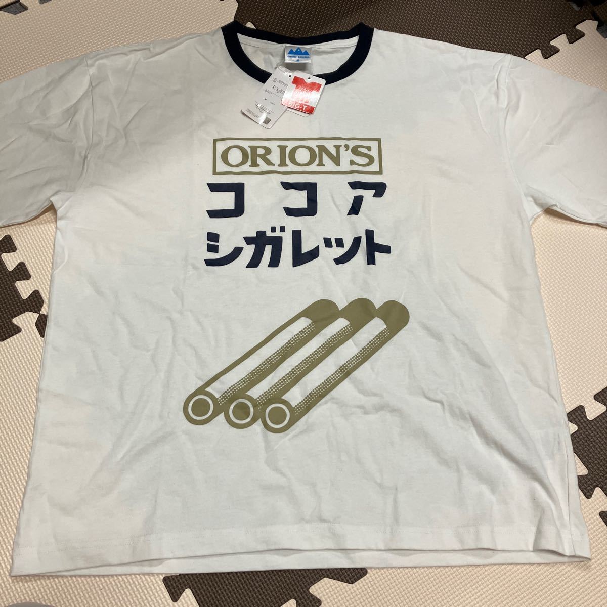 tee ココアシガレットTシャツ Mサイズ BIG-T 半袖Tシャツ 白色 メンズ 昭和 レトロ 駄菓子 コラボ オリオン 新品 タグ付き ORION'S_画像1