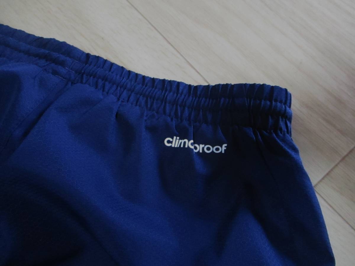 アディダスCLIMA PROOF・３本ライン裾ファスナー付きウインドパンツ・紺色・サイズ１３０㎝_画像4