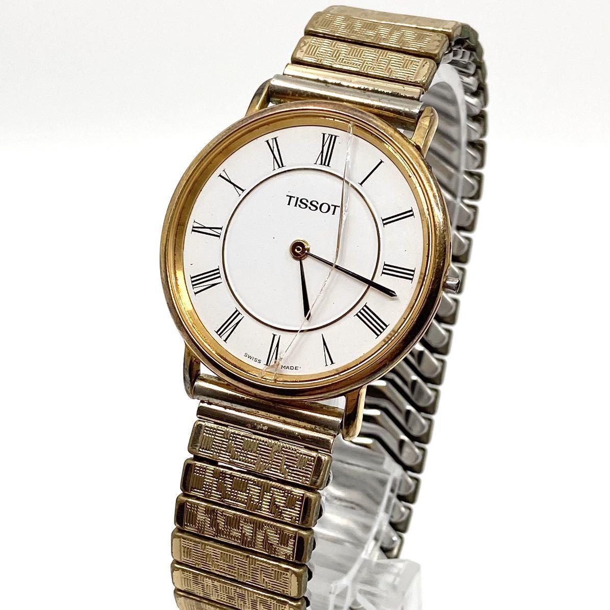 TISSOT 腕時計 蛇腹ベルト ローマンインデックス quartz クォーツ 2針 Swiss スイス製 ホワイト ゴールド 白 金 ティソ D46の画像1