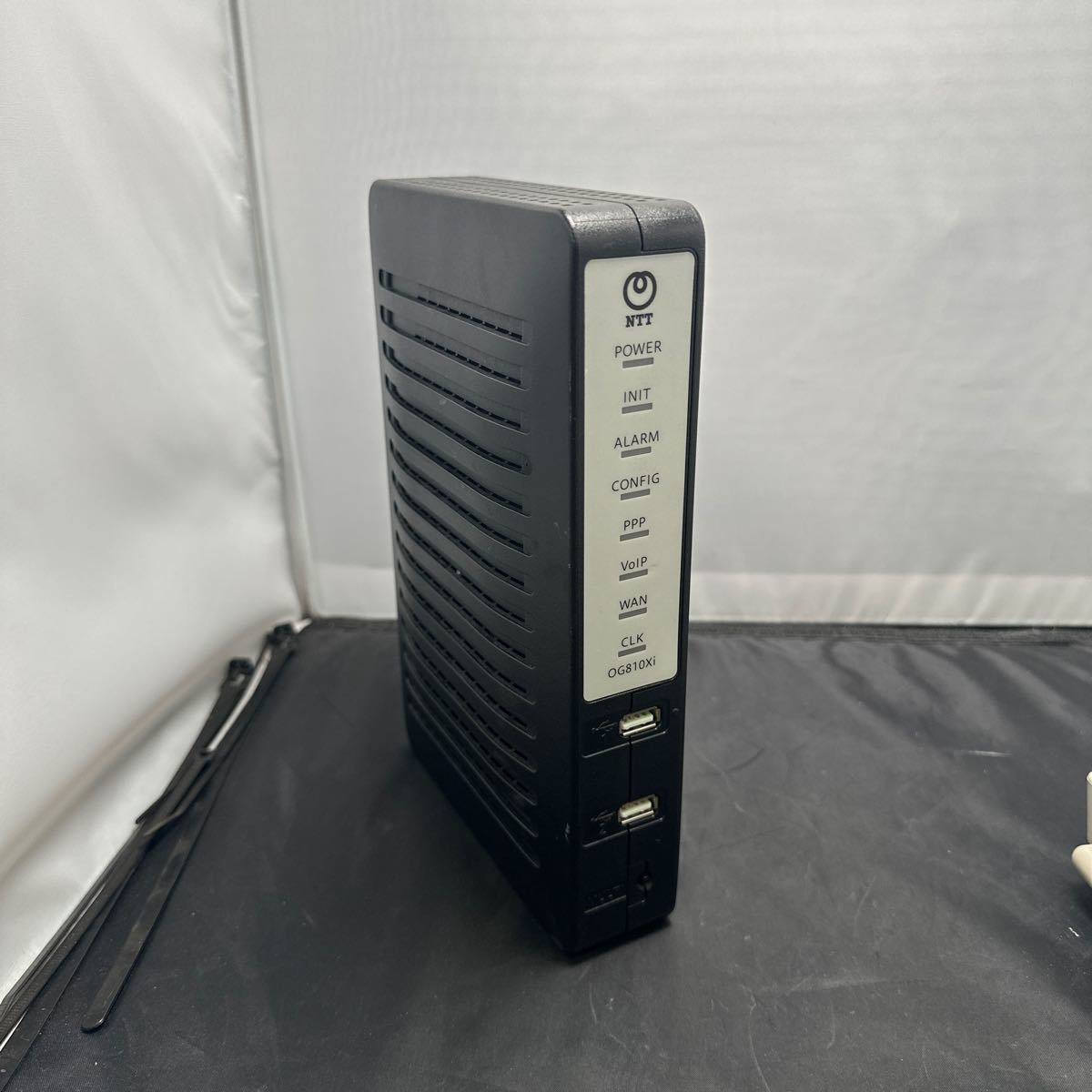 「N21_11T」NTT Netcommunity VoIPルーター OG810Xi 動作品　本体のみ　外傷有り_画像1