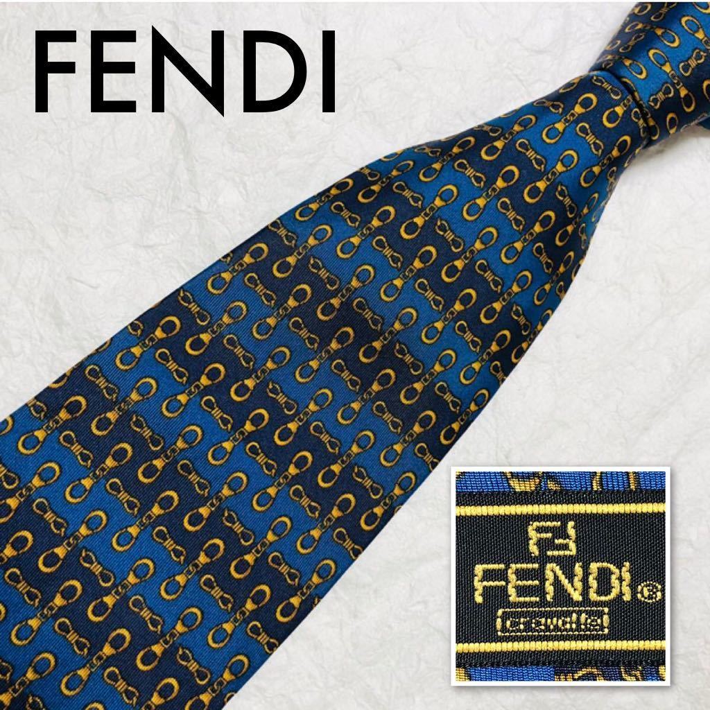 ■美品■FENDI cravatteフェンディ　ネクタイ　金具総柄　ストライプ　シルク100% イタリア製　幅広　ブルー×ゴールド