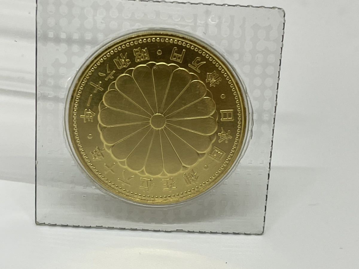 10万円金貨　天皇陛下御在位六十年　記念硬貨 ブリスターパック_画像1