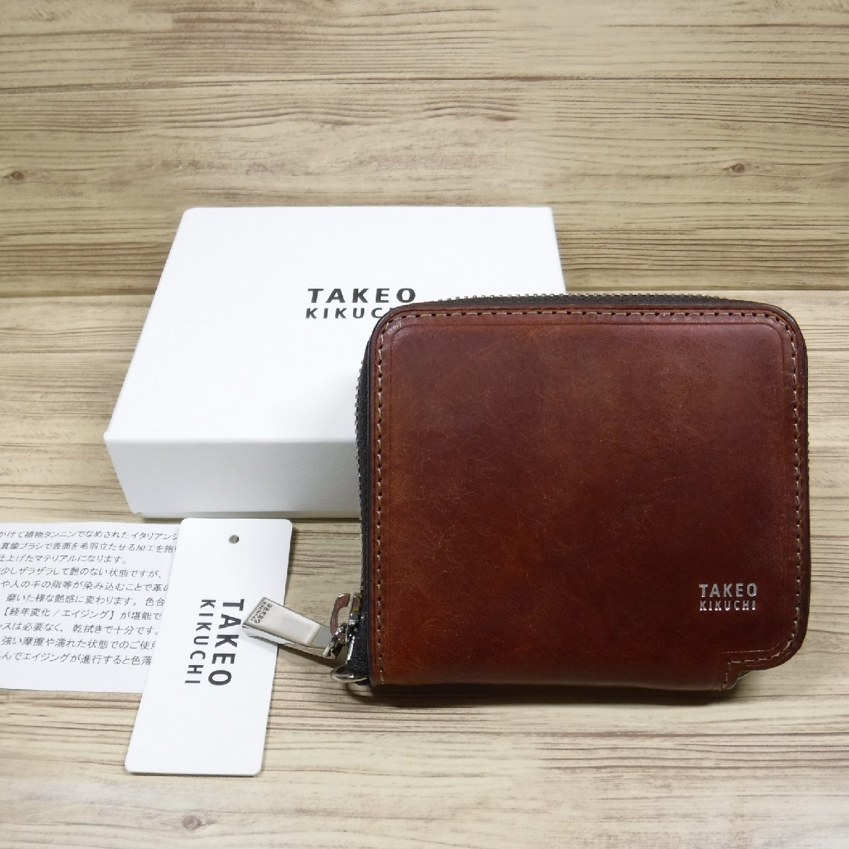 QQ694 タケオキクチ 定価14300円 ラウンドファスナー二つ折り財布 イタリア産 牛革 箱付き新品 茶 ブラウン 780603 TAKEO KIKUCHI_画像1