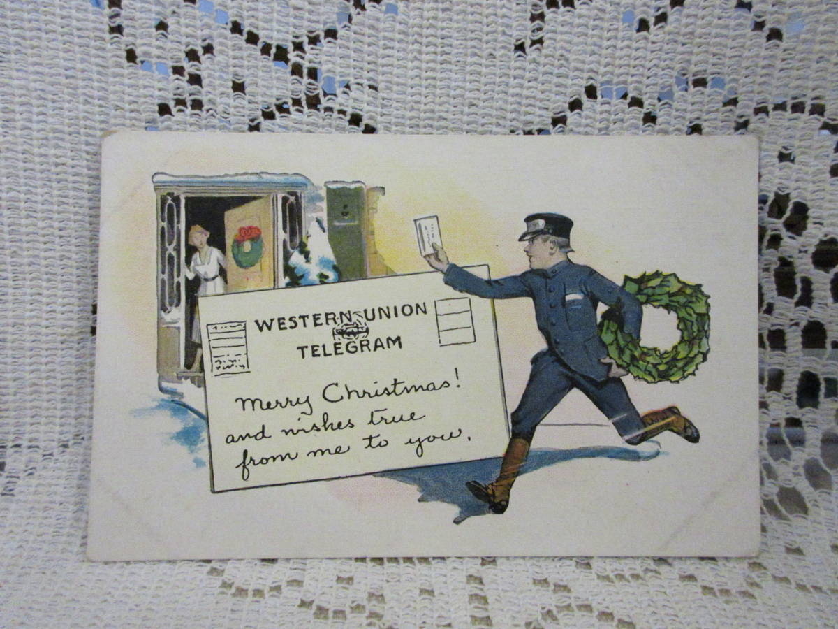 クリスマス　USA製　アンティーク　絵葉書　ポストカード　郵便配達人　リース　電報　女性　ドア　未使用_画像1