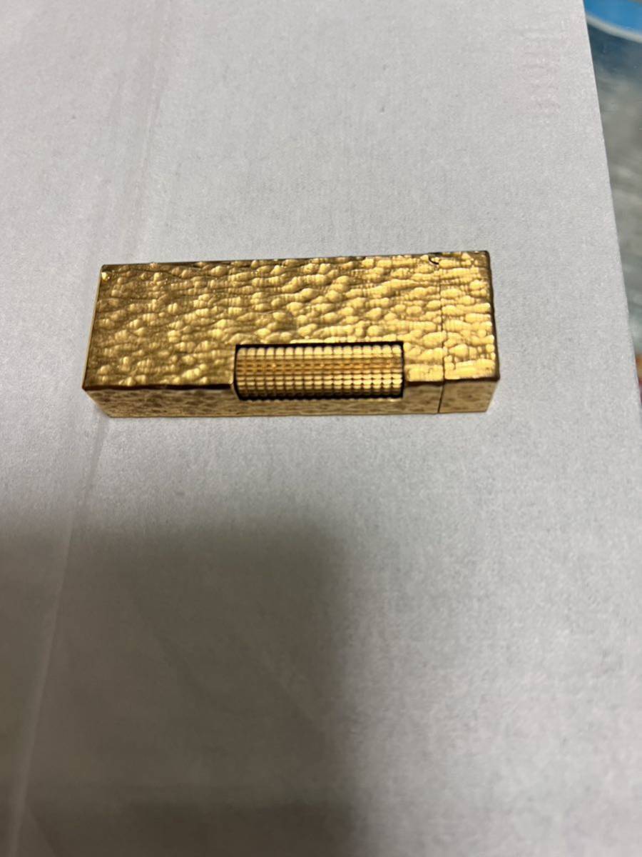 出品者 jastudioさんから購入した、ポンコツの「目立った傷や汚れなし」と表記されていた、ダンヒル ガスライター ゴールドカラー ガスライター