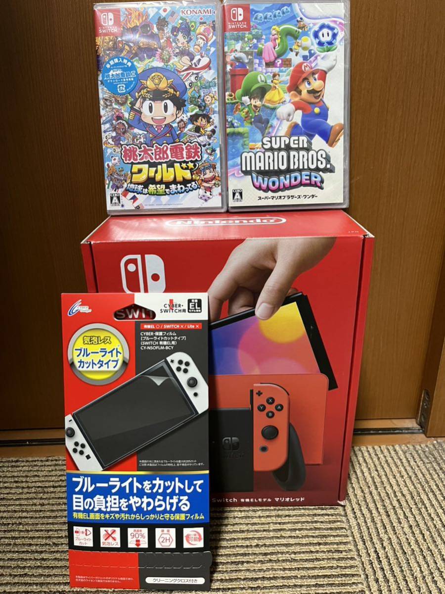 Nintendo Switch 有機ELモデル マリオレッド　ソフト2本セット　新品未開封　マリオワンダー　桃鉄ワールド　保護フィルム付　スイッチ_画像1