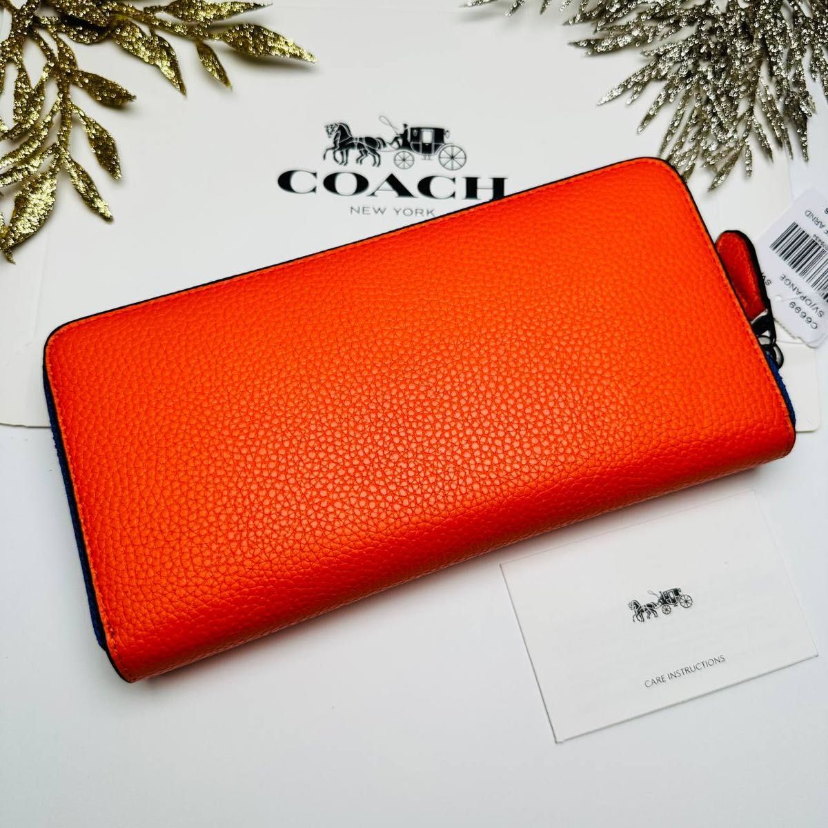 返品無料です COACHコーチ長財布 レディースのオレンジ色 - 小物