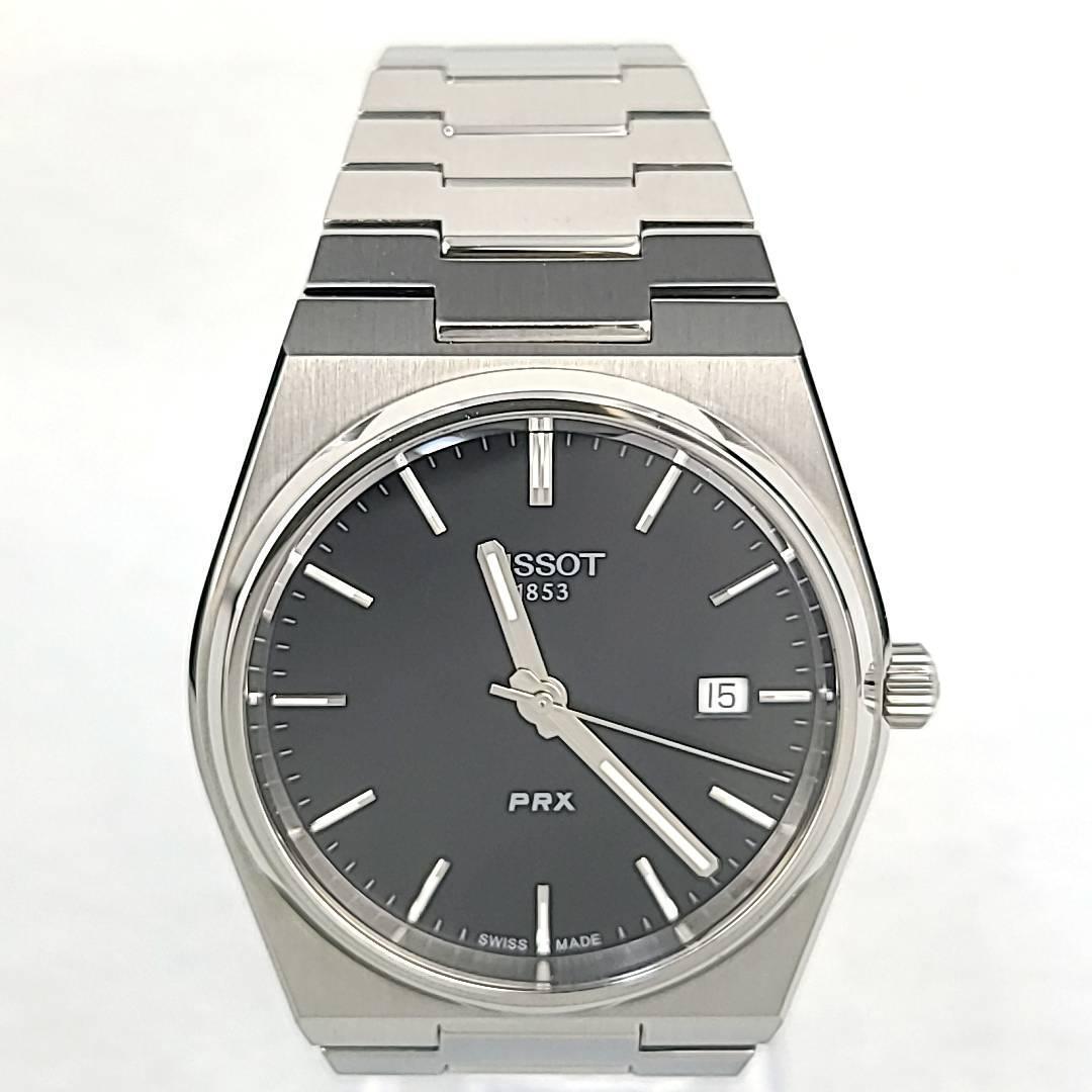 ◇【ほぼ新品】TISSOT ティソ 箱/保証書付 QZ T137410 PRX 黒文字盤 デイト ラウンド メンズ腕時計