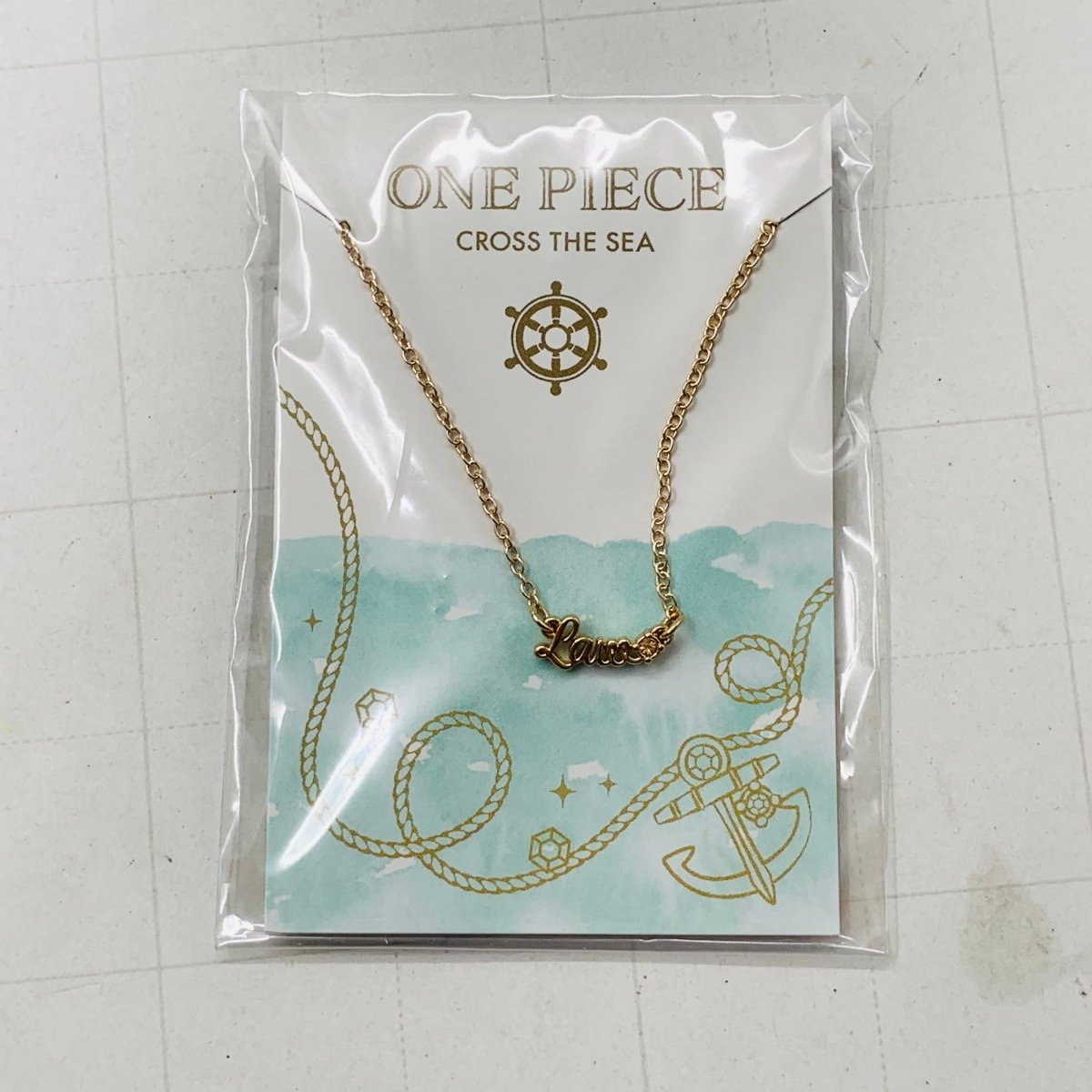 新品未開封 ONE PIECE ワンピース 麦わらストア ネックレス ロー LAW cross the sea_画像1