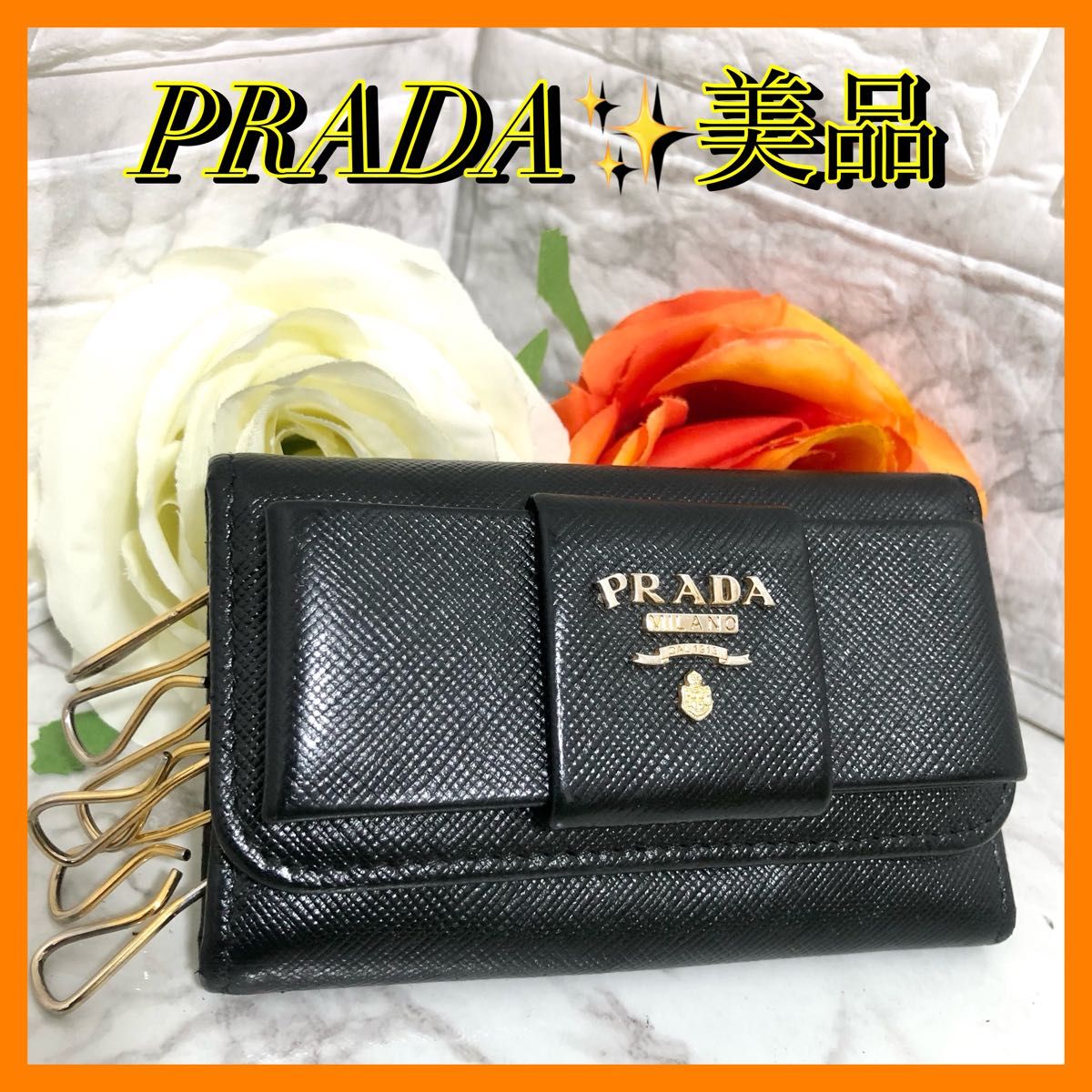 正規店仕入れの プラダ PRADA キーケース リボン ブラック 黒