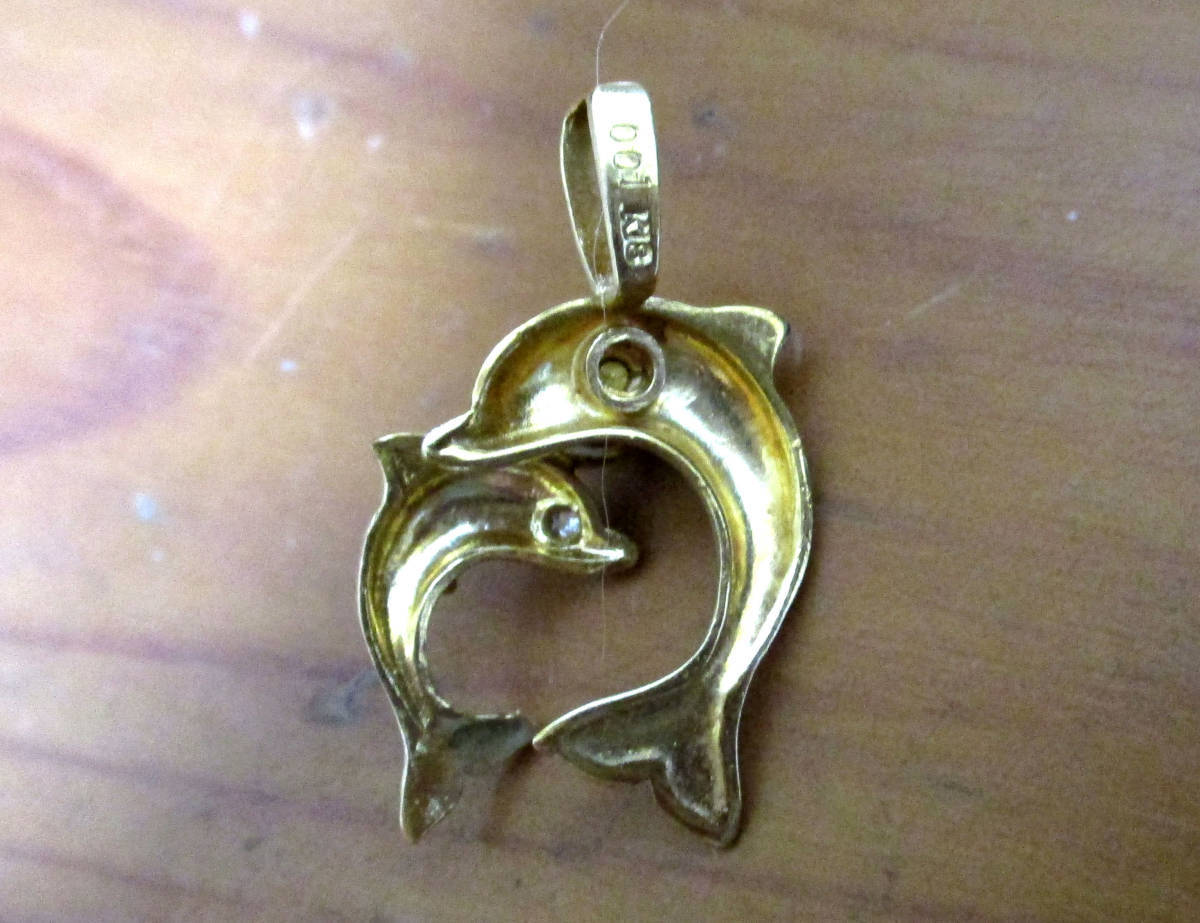 ] used dolphin . motif . did pendant top K18. with diamond 