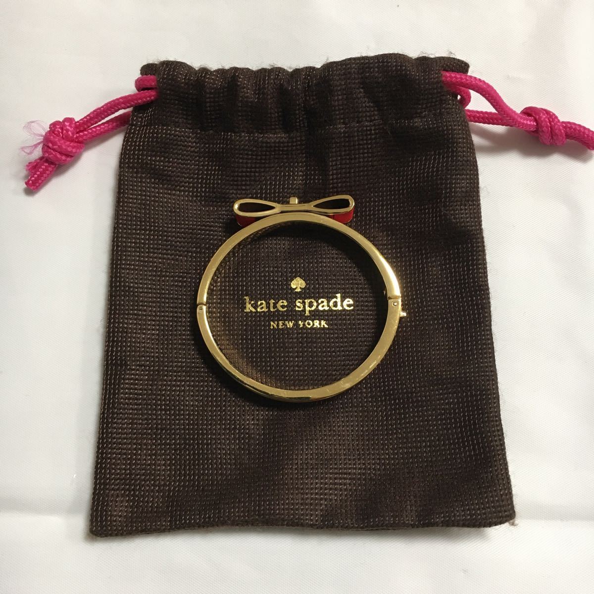 kate spade ケイトスペード バングル リボンモチーフ レッドオレンジ ゴールド 保存袋 ブレスレット アクセサリー_画像1