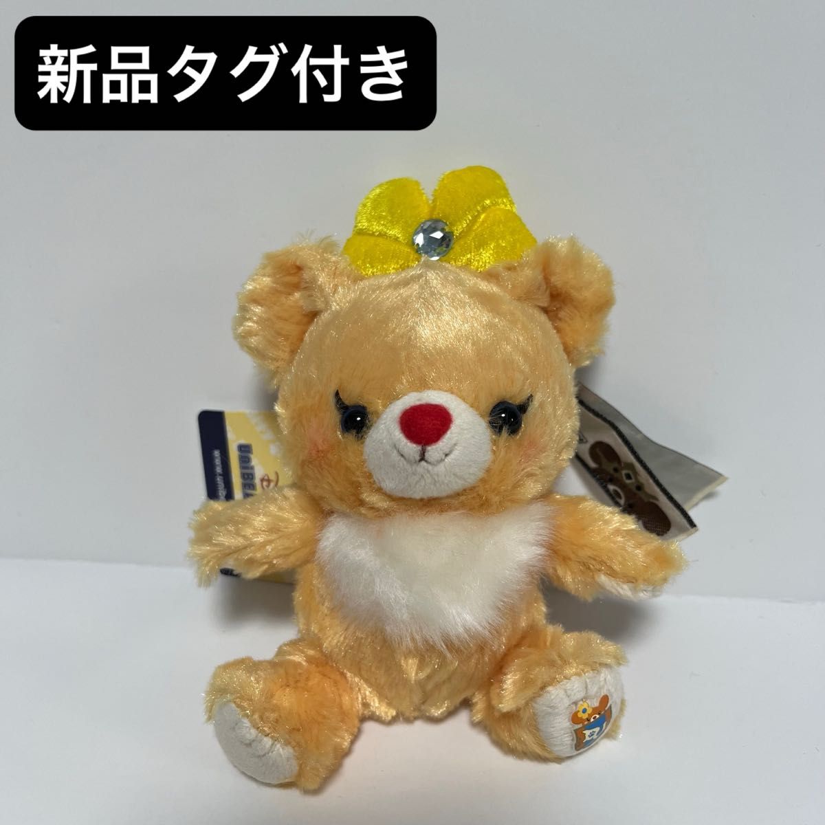 【新品タグ付き】ディズニーストア ユニベア アプリコット バッジ付きキーチェーン