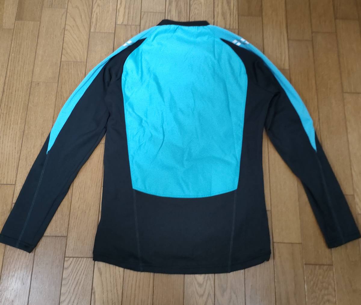 ( thing 50) regular price 12,100 jpy [ new goods ] Umbro thermal storage heat insulation +5 times pi stereo top UFA4430 men's M