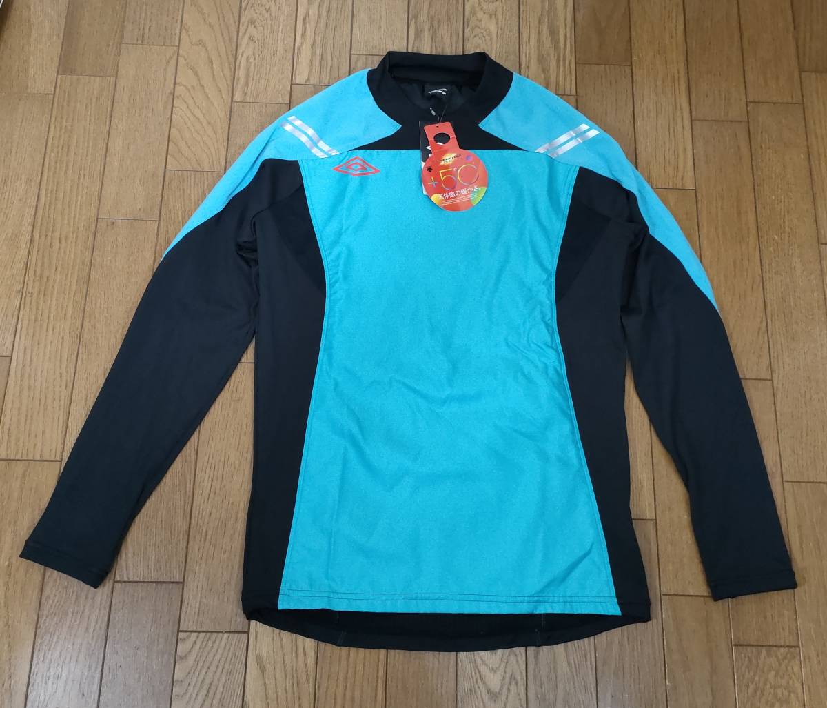 ( thing 50) regular price 12,100 jpy [ new goods ] Umbro thermal storage heat insulation +5 times pi stereo top UFA4430 men's M
