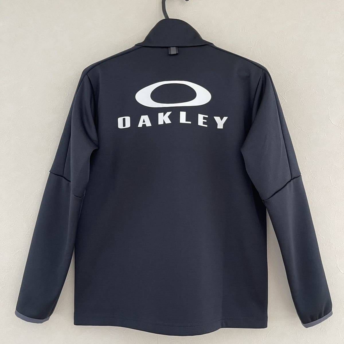 超美品 OAKLEY(オークリー)スポーツ ジャケット 150cm キッズ 子供 ブラック 長袖 使用2回 アウトドア 黒 ルックスオティカジャパン(株)_後側